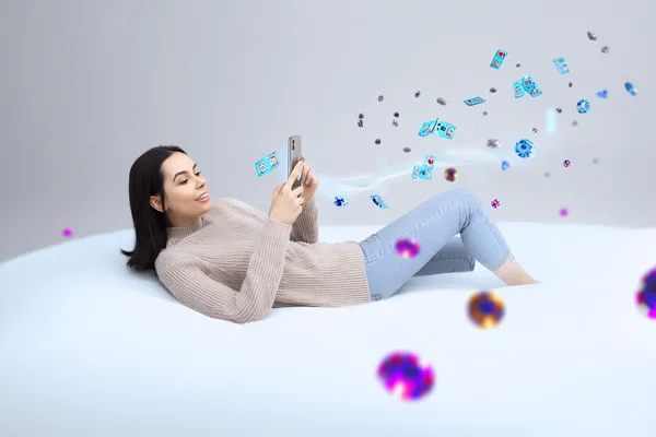 A cheerful woman in traditional clothing using her smartphone during a festive moment, showing how easily the MOSTBED app fits into everyday life.